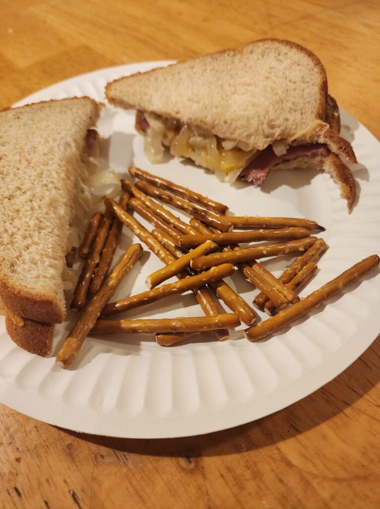 Fried Bologna with sauteed onions on a plate