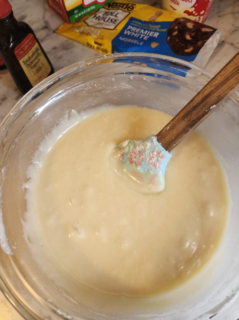 melting white chocolate chips, butter and sweetened condensed milk